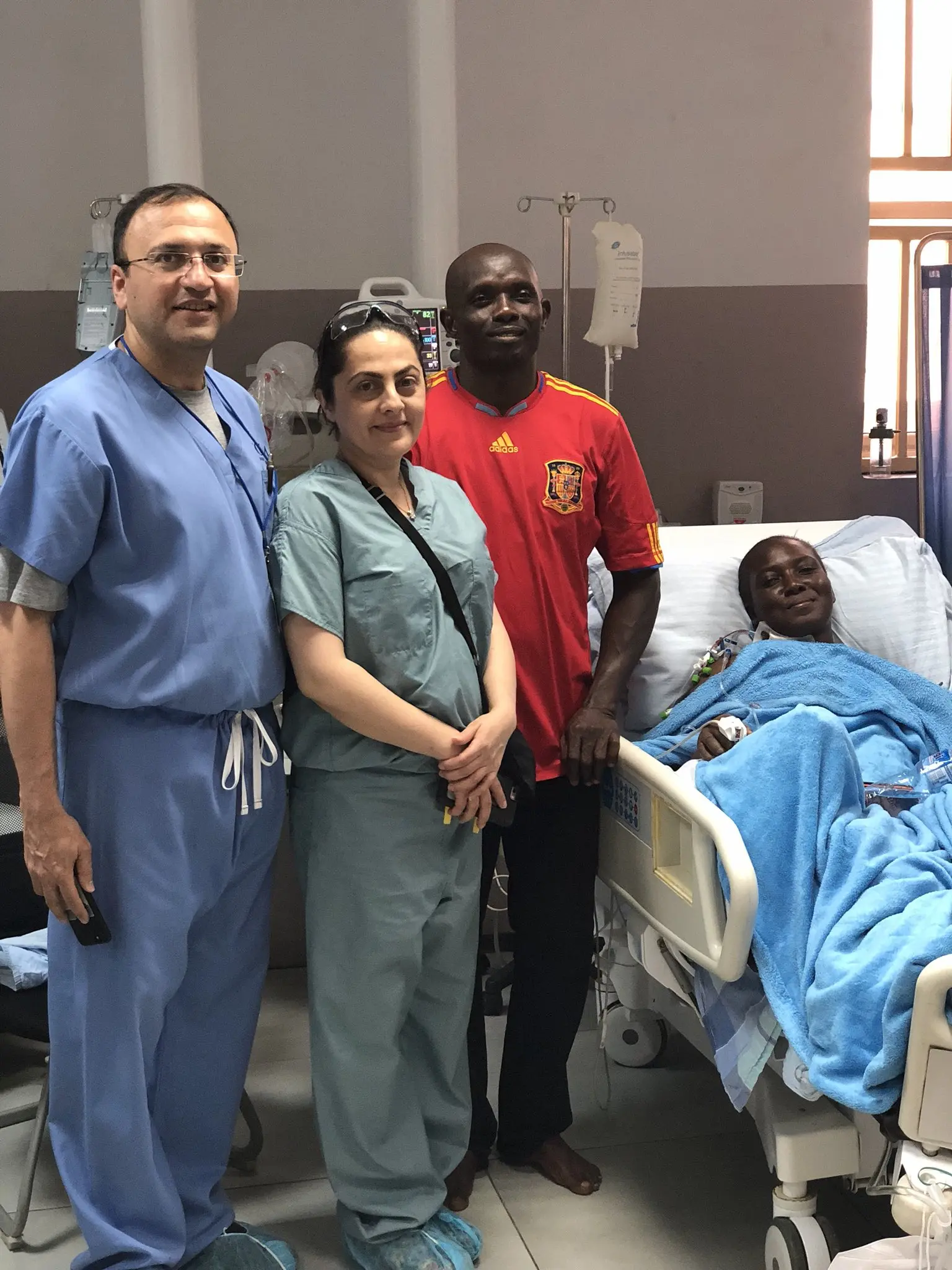 Medical professionals performing vascular procedure